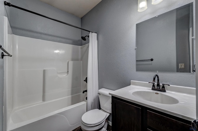 full bath featuring a textured wall, toilet, vanity, and shower / bathtub combination with curtain