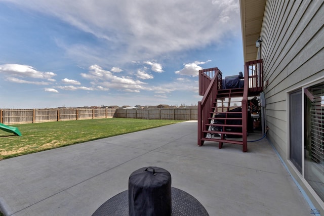 view of patio featuring a fenced backyard and stairway