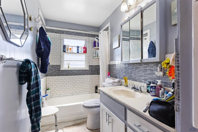 1021 Blaine Ave, Rapid City, SD 57701 - bathroom featuring toilet, vanity, tile patterned floors, and shower / bath combo with shower curtain