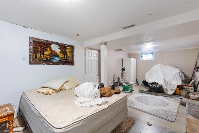 1021 Blaine Ave, Rapid City, SD 57701 - bedroom featuring unfinished concrete floors and visible vents