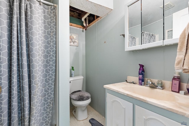 1021 Blaine Ave, Rapid City, SD 57701 - bathroom featuring vanity, speckled floor, a shower with curtain, toilet, and visible vents