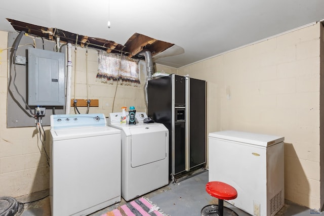 1021 Blaine Ave, Rapid City, SD 57701 - laundry room featuring electric panel, laundry area, and washer and clothes dryer