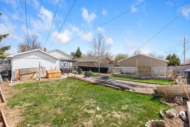 1021 Blaine Ave, Rapid City, SD 57701 - view of yard with fence, a patio area, and a garden