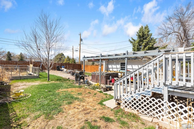 1021 Blaine Ave, Rapid City, SD 57701 - view of yard with a fenced backyard, a garden, and a hot tub