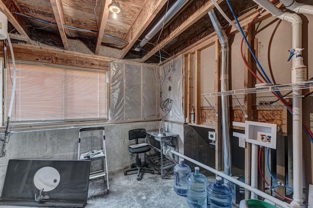 miscellaneous room with unfinished concrete flooring