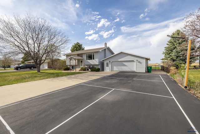 view of front facade with a front lawn and a garage
