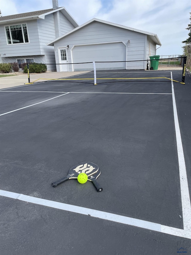 uncovered parking lot featuring fence