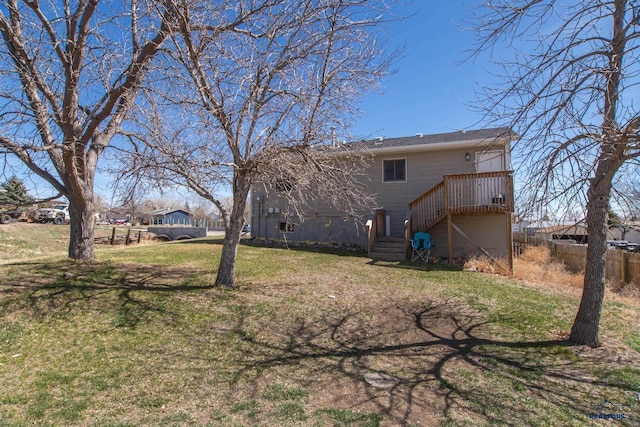 1711 Plateau Ln, Rapid City, SD 57703 - back of house featuring fence, a lawn, and a deck