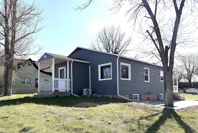 302 S S 18th St, Hot Springs, SD 57747 - view of front of house with ac unit, a front lawn, covered porch, and a chimney