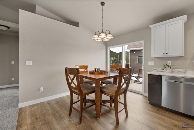 1073 Quinn Dr, Hill City, SD 57745 - dining area featuring baseboards, a notable chandelier, and light wood-type flooring