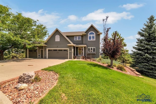 5325 Snowberry Ct, Rapid City, SD 57702 - traditional-style house with concrete driveway, a front lawn, and a garage