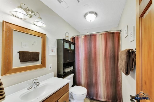 5325 Snowberry Ct, Rapid City, SD 57702 - full bath with toilet, vanity, a shower with shower curtain, and visible vents