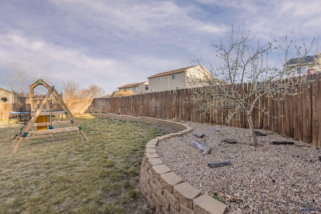 4906 Hansen Ln, Rapid City, SD 57703 - view of yard featuring a trampoline and a playground