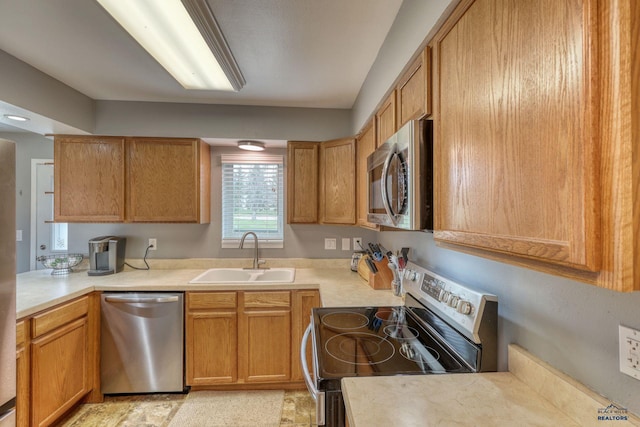 5B Statesboro, Belle Fourche, SD 57717 - kitchen featuring light countertops, stainless steel appliances, and a sink