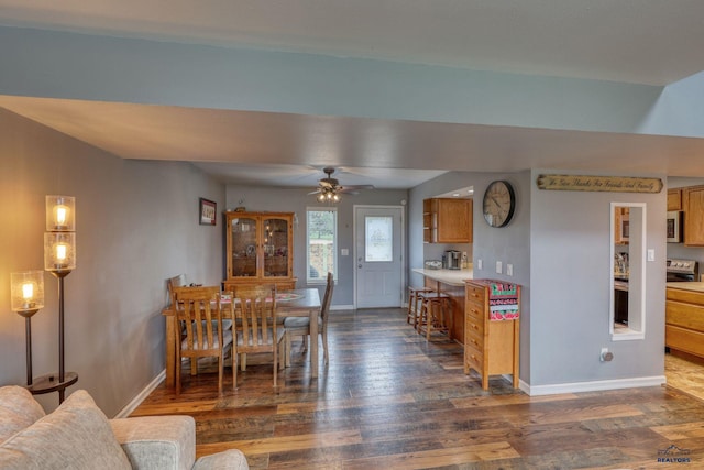 5B Statesboro, Belle Fourche, SD 57717 - dining area featuring dark wood finished floors, a ceiling fan, and baseboards