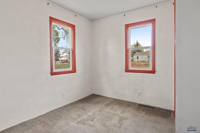 235 E E St, Patrick, Rapid City, SD 57701 - carpeted spare room with visible vents