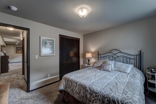 bedroom with a closet and carpet floors