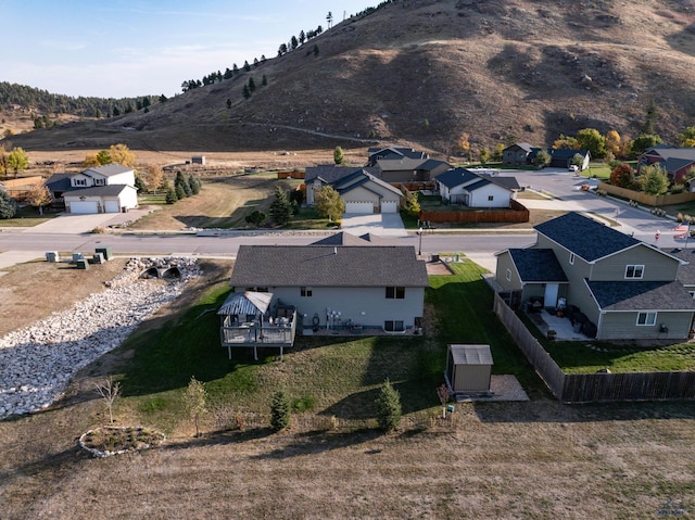 drone / aerial view with a residential view and a mountain view