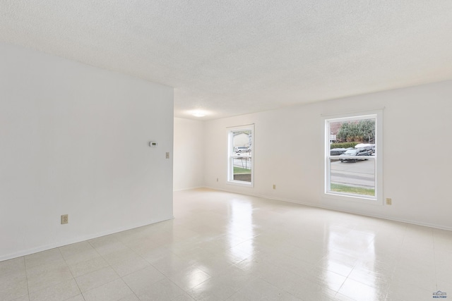 1937 Hillsview Dr, Rapid City, SD 57702 - empty room with baseboards and a textured ceiling