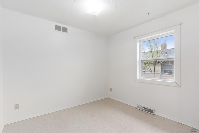 1937 Hillsview Dr, Rapid City, SD 57702 - spare room with light floors, visible vents, and baseboards