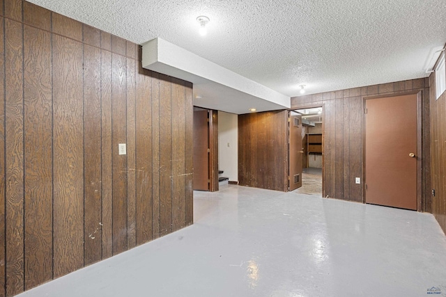 1937 Hillsview Dr, Rapid City, SD 57702 - finished basement featuring wood walls and a textured ceiling