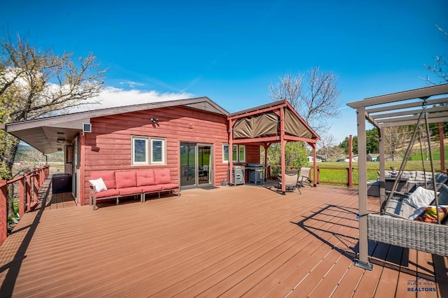 wooden deck featuring an outdoor living space