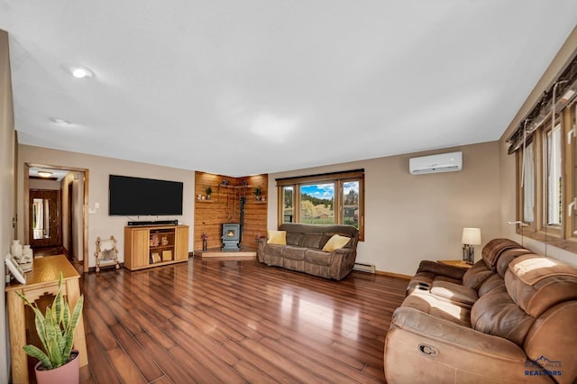 living area featuring baseboards, a wood stove, dark wood-style floors, and a wall mounted AC
