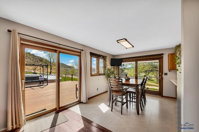 dining room with baseboards