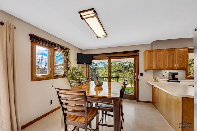 dining room with baseboards