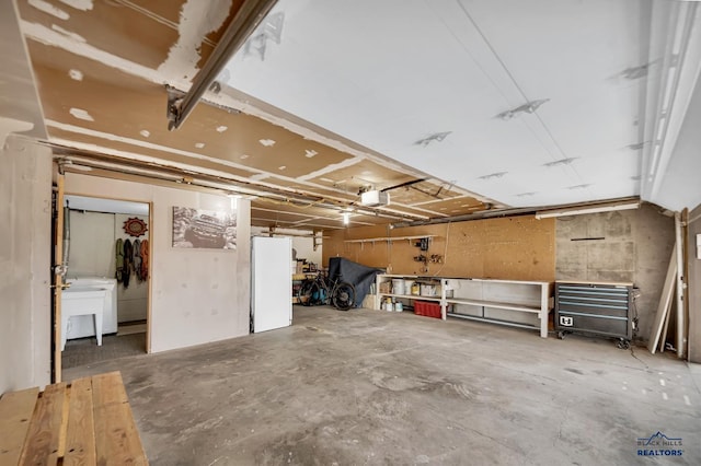 garage featuring a garage door opener and a sink
