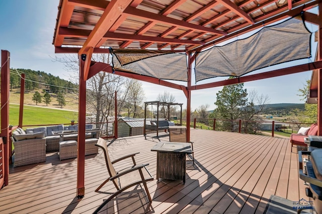 deck featuring a pergola and outdoor lounge area