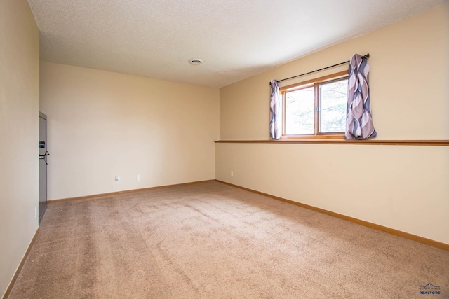4028 Prairie View Dr, Rapid City, SD 57701 - carpeted spare room with a textured ceiling and baseboards