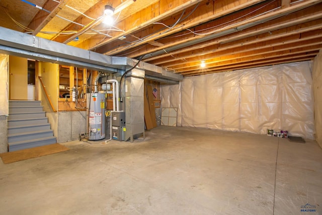 4028 Prairie View Dr, Rapid City, SD 57701 - unfinished below grade area featuring gas water heater, heating unit, and stairs