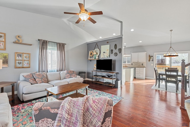 living room with baseboards, recessed lighting, vaulted ceiling, wood finished floors, and a ceiling fan