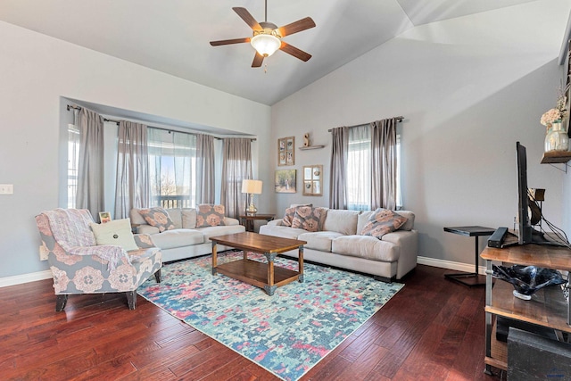 living area featuring dark wood-type flooring, plenty of natural light, a ceiling fan, and high vaulted ceiling