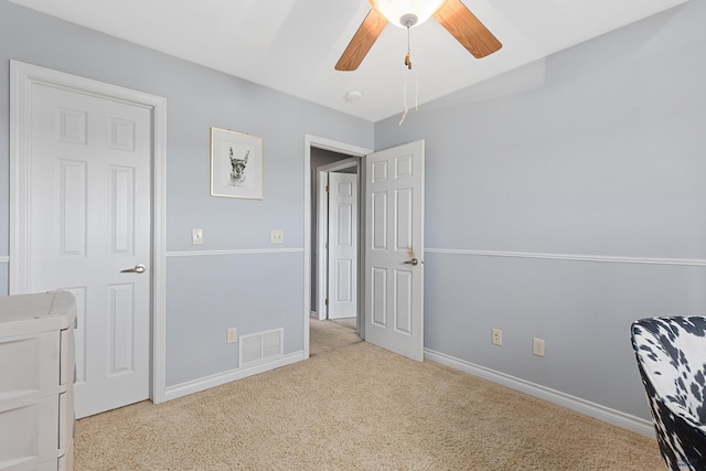 carpeted bedroom featuring visible vents, ceiling fan, and baseboards