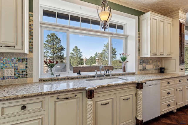 kitchen with a sink, decorative backsplash, dishwasher, and a healthy amount of sunlight