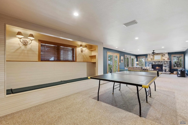 playroom featuring a fireplace, carpet, recessed lighting, and visible vents