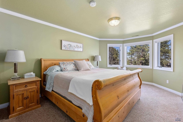 carpeted bedroom featuring baseboards, ornamental molding, a textured ceiling, and visible vents