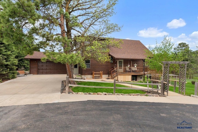 20842 Legacy, Sturgis, SD 57785 - log home with fence private yard, a garage, roof with shingles, and concrete driveway