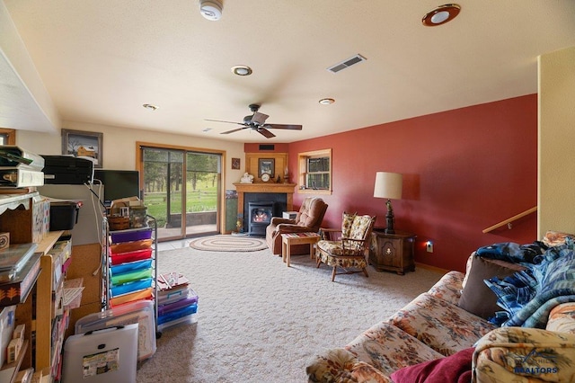 20842 Legacy, Sturgis, SD 57785 - living room with a glass covered fireplace, carpet, a ceiling fan, and visible vents