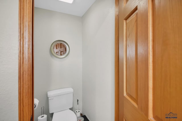 bathroom featuring toilet