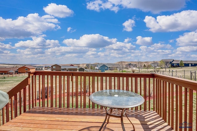 wooden terrace with a residential view