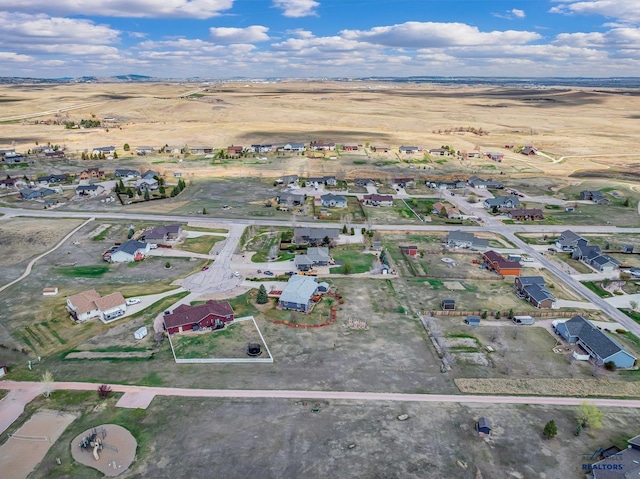 birds eye view of property with a residential view