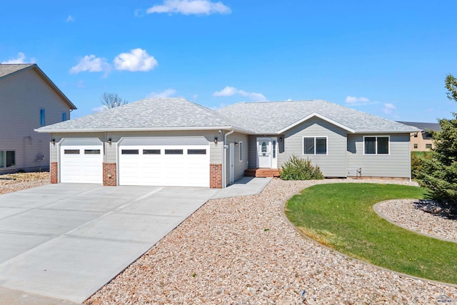 ranch-style home featuring roof with shingles, an attached garage, concrete driveway, and brick siding