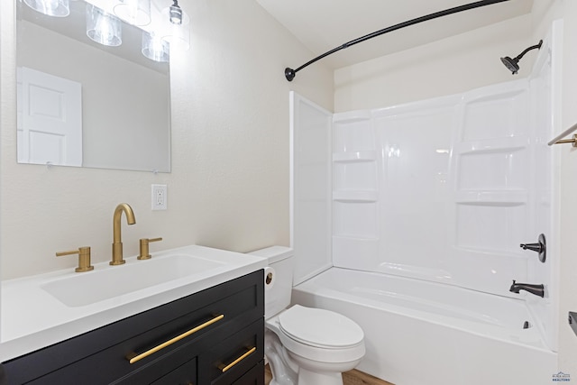 bathroom featuring vanity, toilet, and bathtub / shower combination