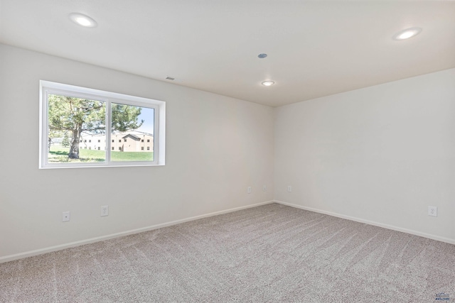 unfurnished room with carpet floors and recessed lighting