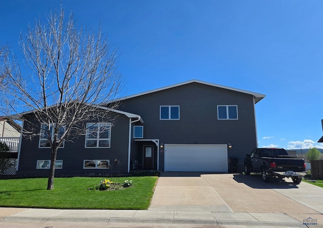 127 Union St, Spearfish, SD 57783 - tri-level home with driveway, a front yard, and a garage