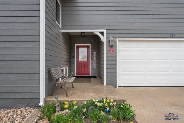 127 Union St, Spearfish, SD 57783 - view of exterior entry with a garage