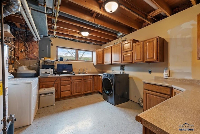 127 Union St, Spearfish, SD 57783 - clothes washing area featuring electric panel, cabinet space, and independent washer and dryer
